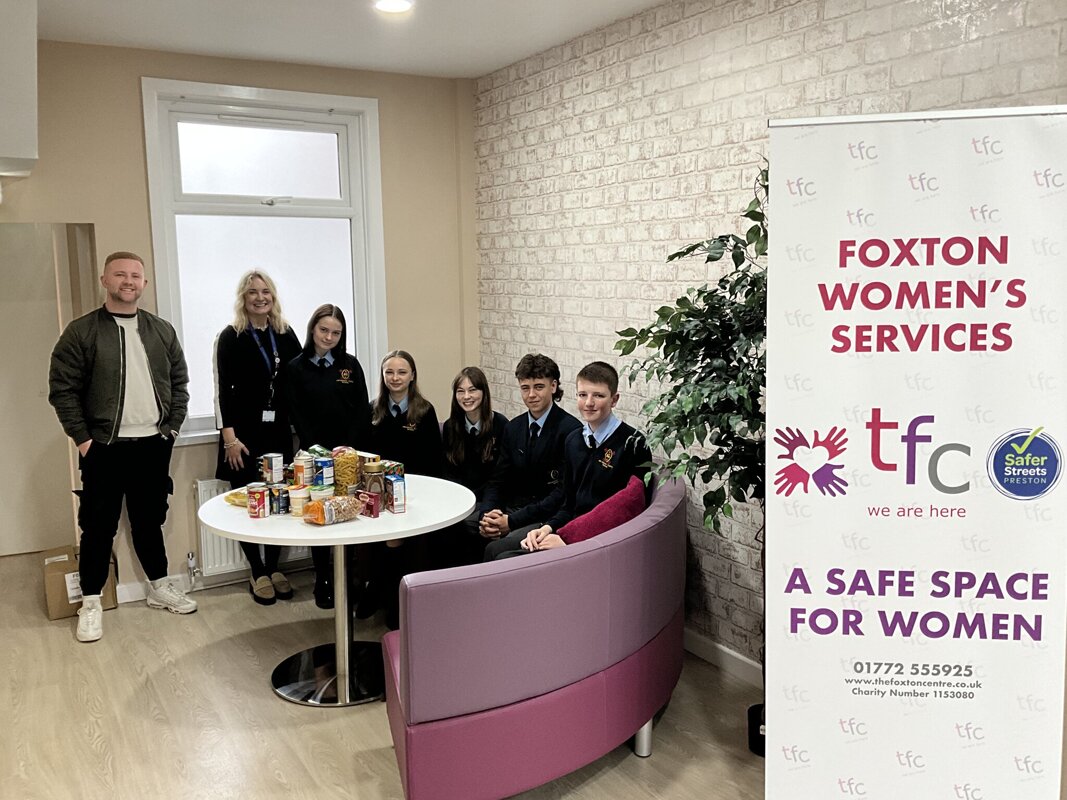 Image of Year 11 pupils donate food from the Harvest collection to The Foxton Centre